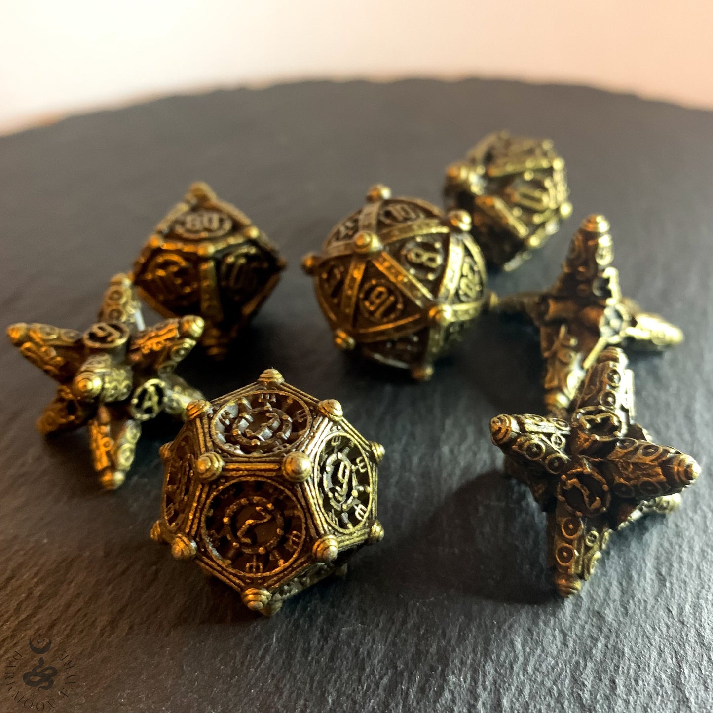 DnD 7 Bronze Ancient Mechanical Solid Heavy Metal Polyhedral Dice Set With A Fairtrade Cotton Storage Pouch - Darkmoon Fayre