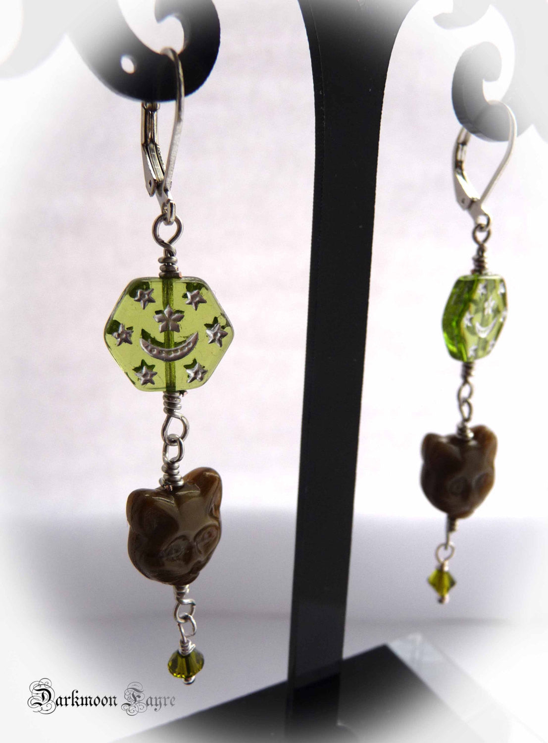 Celestial Feline Smoky Topaz Glass Cat Earrings. Hexagonal Glass Star & Moon Beads. Olive Swarovski Bicone Crystal Dangles. Silver Plated. - Darkmoon Fayre